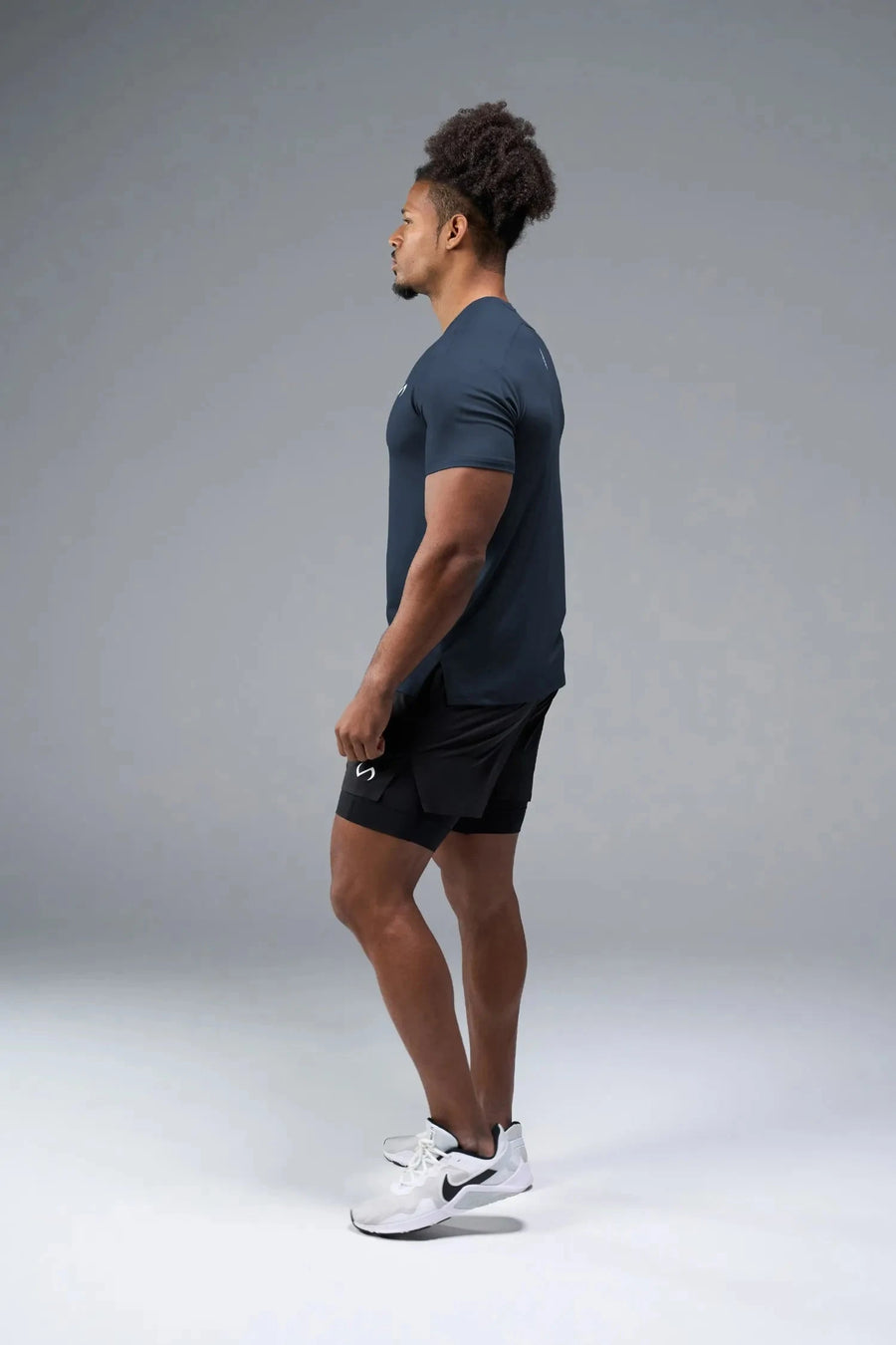 Side View of Blue TLF Infi-Dry Swole Tee, crafted with our custom swole fit and utilizing our infi-dry fabric technology 