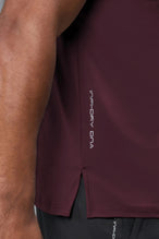 Side View of Maroon TLF Infi-Dry Swole Tee, crafted with our custom swole fit and utilizing our infi-dry fabric technology 