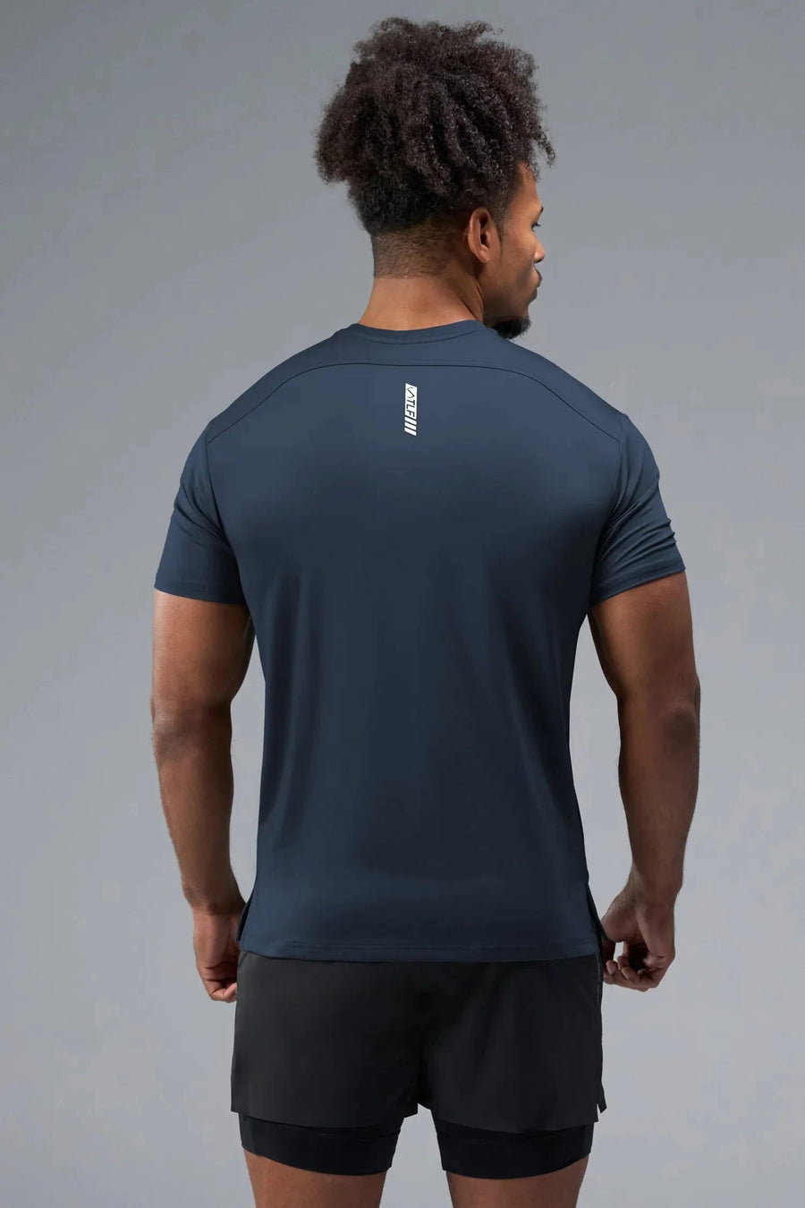Side View of Blue TLF Infi-Dry Swole Tee, crafted with our custom swole fit and utilizing our infi-dry fabric technology 