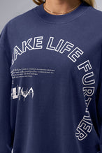 Detail Front View Of Blue Stonewash TLF Unisex Arc Dura Cotton Oversized Long Sleeve