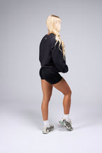 Side View Of Unisex Classic Cotton Luxe Oversized LS Tee in Black