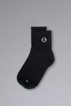 Front View of Black the TLF Evolve Half Crew Socks featuring an embroidered TLF logo and interiors take life further stitched detailing with a cushioned footbed
