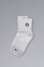 Front View of White TLF Evolve Half Crew Socks featuring an embroidered TLF logo and interiors take life further stitched detailing with a cushioned footbed