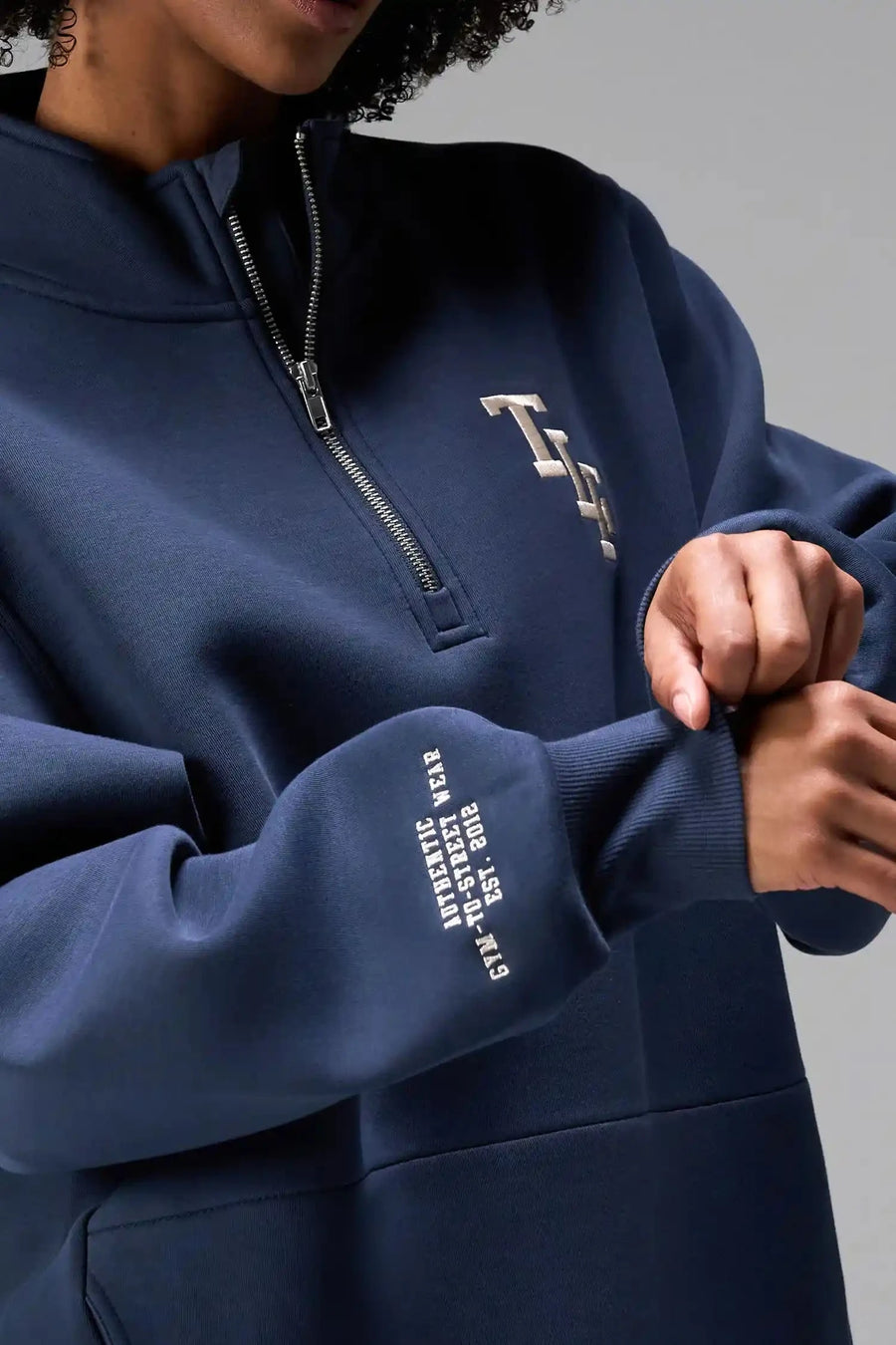 Front View of Blue TLF GTS Scuba Tech Quarter-Zip Pullover, featuring a ¼ zip pullover, sleek design and kangaroo pockets 