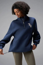Front View of Blue TLF GTS Scuba Tech Quarter-Zip Pullover, featuring a ¼ zip pullover, sleek design and kangaroo pockets 