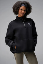  

Front View of Black TLF GTS Scuba Tech Quarter-Zip Pullover, featuring a ¼ zip pullover, sleek design and kangaroo pockets 
