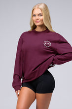 Front View of Red the TLF Redefine Original Cotton Luxe Oversized LS Tee that features a bold back graphic in an oversized fit. 