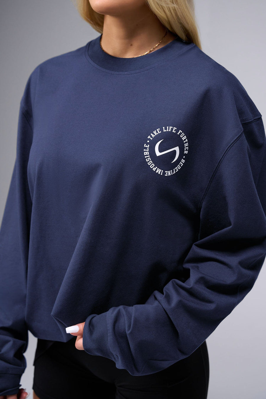 Front View of Blue the TLF Redefine Original Cotton Luxe Oversized LS Tee that features a bold back graphic in an oversized fit. 
