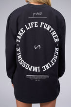 Back View of Black the TLF Redefine Original Cotton Luxe Oversized LS Tee that features a bold back graphic in an oversized fit. 