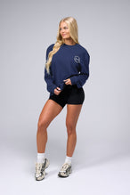 Front View of Blue the TLF Redefine Original Cotton Luxe Oversized LS Tee that features a bold back graphic in an oversized fit. 