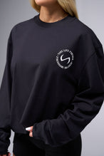 Front View of Black the TLF Redefine Original Cotton Luxe Oversized LS Tee that features a bold back graphic in an oversized fit. 