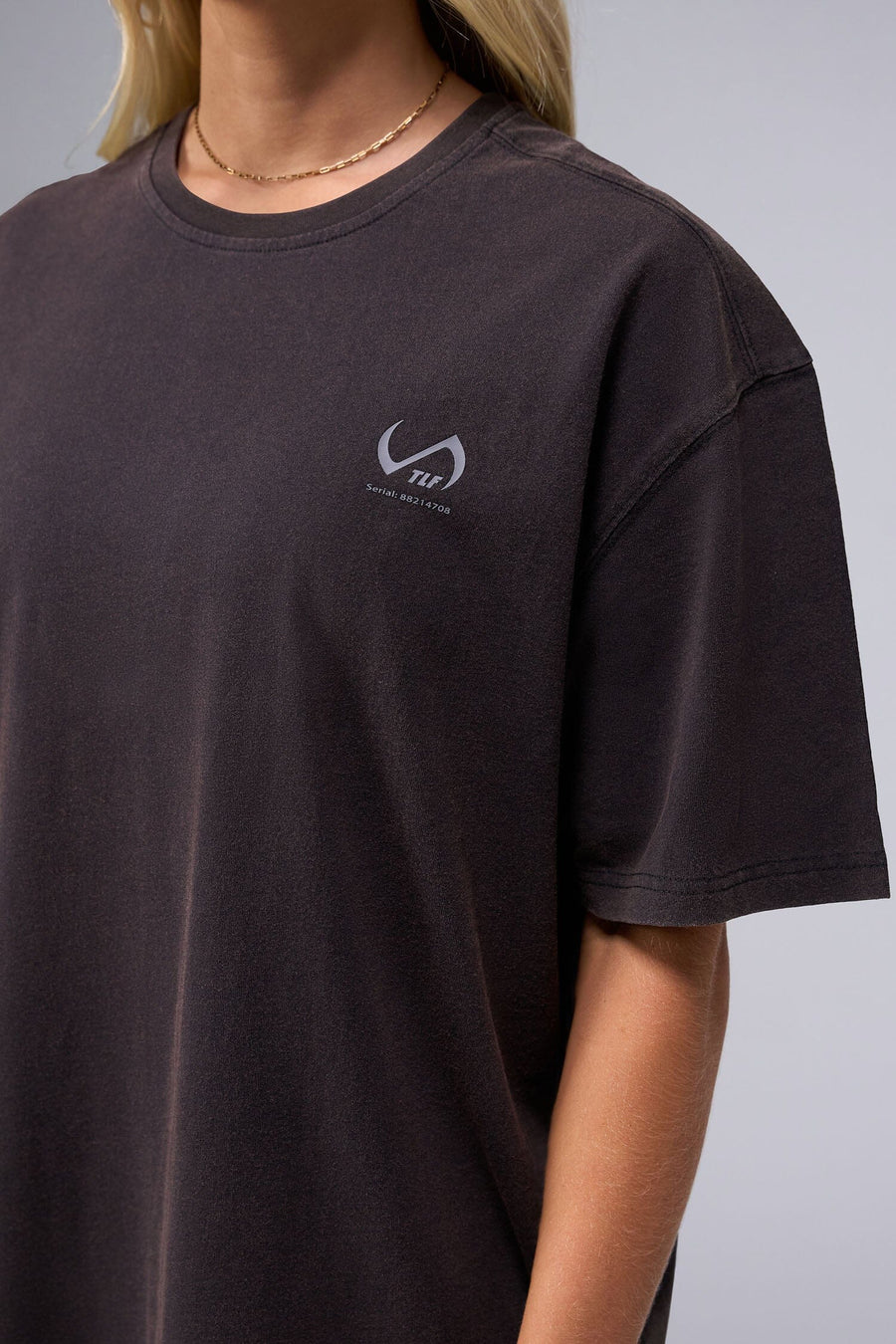 Detail Front View Of Black Stonewash TLF Unisex TM Dura Cotton Oversized Tee