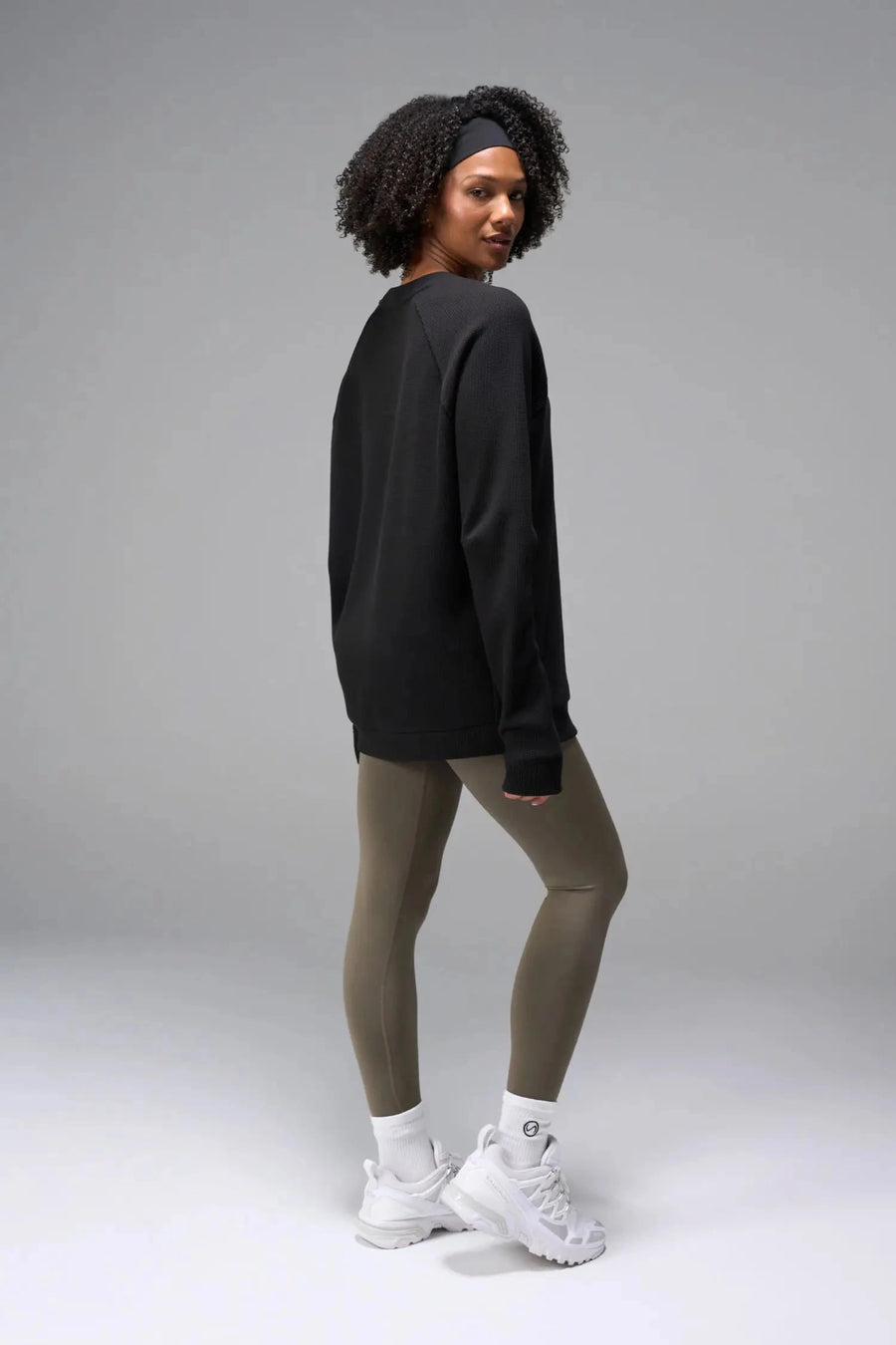 Side View of Black the TLF Waffle Tech Crew Neck featuring a raglan sleeve in our premium waffle knit fabric