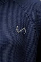 Detail Front Logo View of Blue the TLF Waffle Tech Crew Neck featuring a raglan sleeve in our premium waffle knit fabric