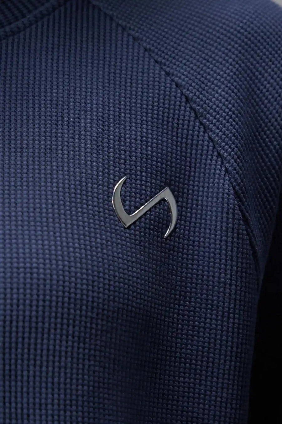 Detail Front Logo View of Blue the TLF Waffle Tech Crew Neck featuring a raglan sleeve in our premium waffle knit fabric